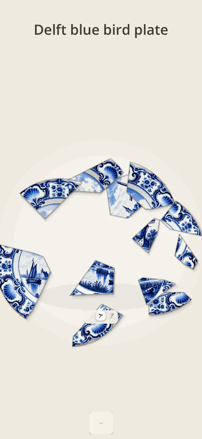 Fragments of a Delft blue plate coming together again.